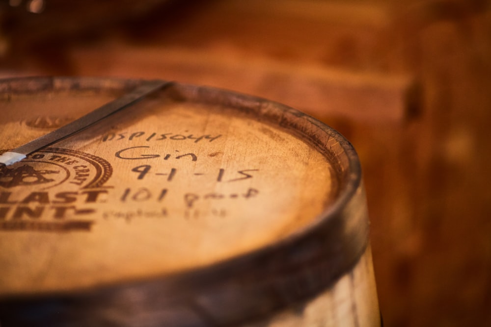 a close up of a wooden barrel with a clock on it