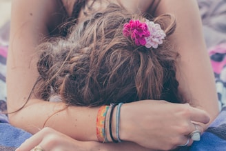 woman kneeling with face on ground