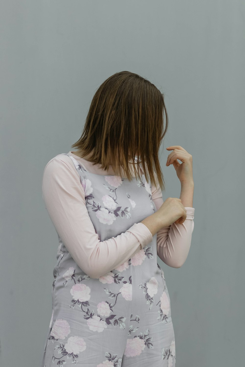 a woman standing with her arms crossed