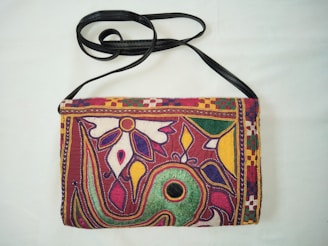 Close-up of a colorful handmade bag with intricate stitching and unique patterns.