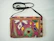 Close-up of a colorful sublimated makeup bag featuring rustic-themed graphics.