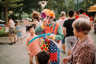 clown doing peace hand gesture