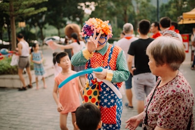 clown doing peace hand gesture