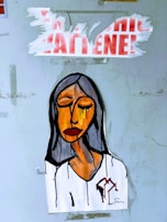 A painted artwork of a person with closed eyes and a somber expression, featuring bold lines and shades of orange, brown, and black. The background is a light, textured surface, with torn red and white text above the figure.