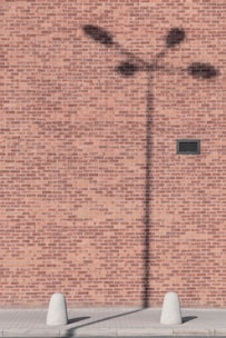 silhouette of street lamp on wall