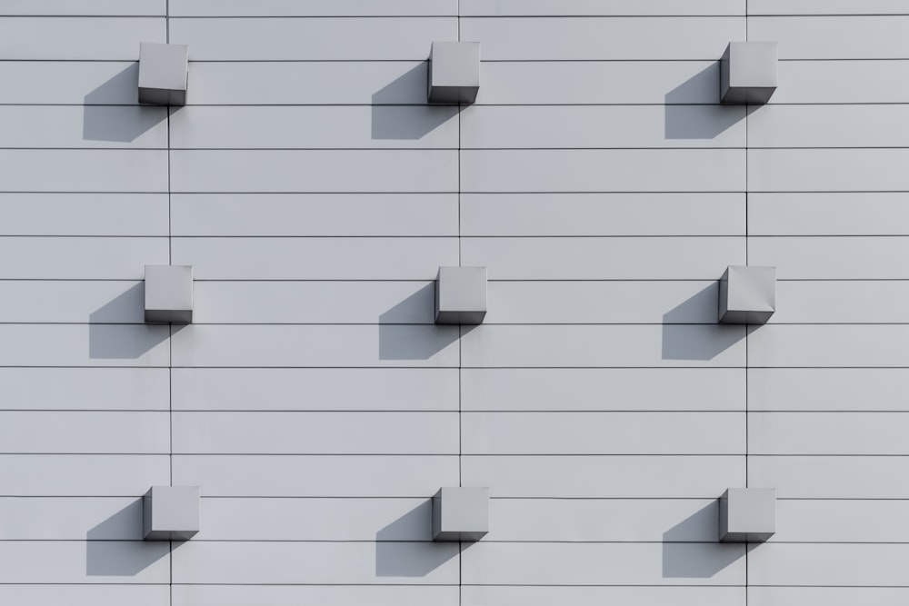 a white wall with a bunch of shelves on it