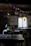 Warm Scandinavian-style photo of a rustic artisanal restaurant interior with natural light.