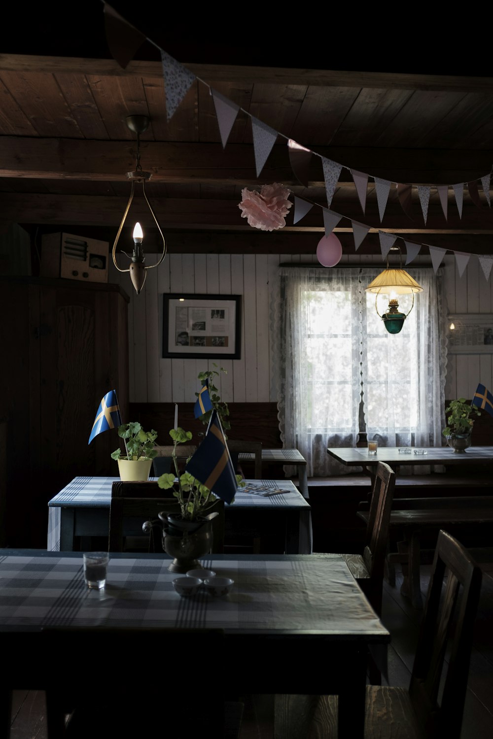 brown wooden table near window