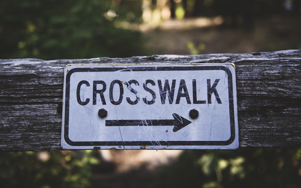 white and black Crosswalk signage