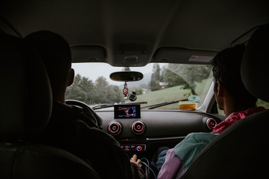 two men sitting on car front seats in Königssee Germany