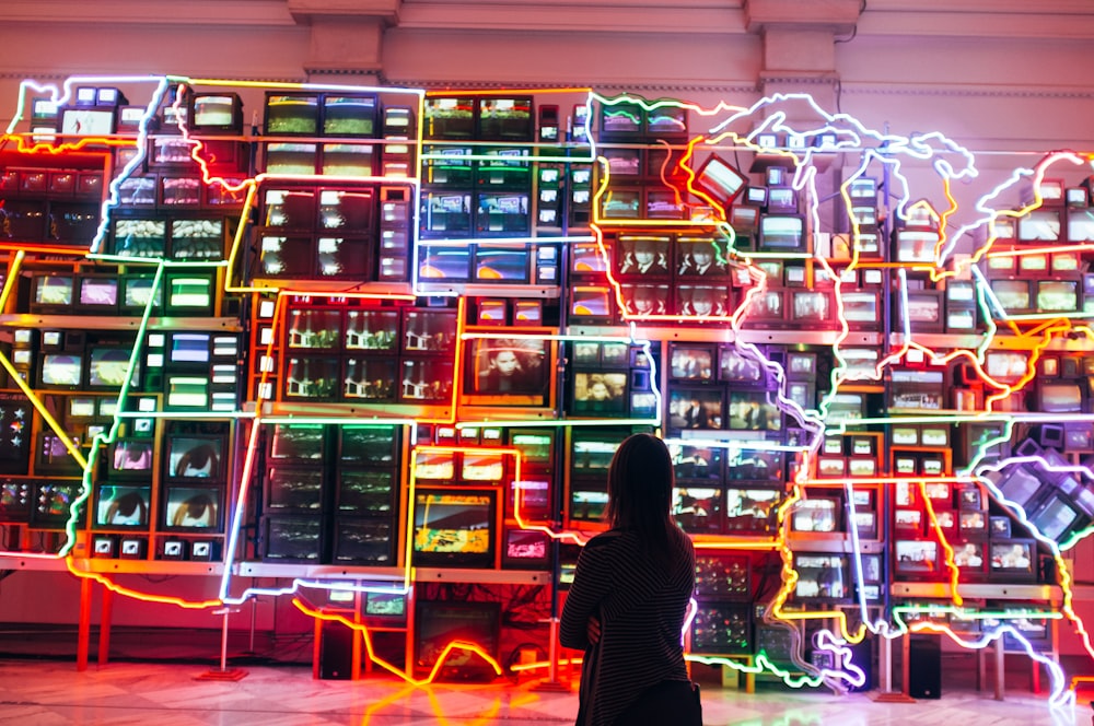 woman looking at monitors with light decor