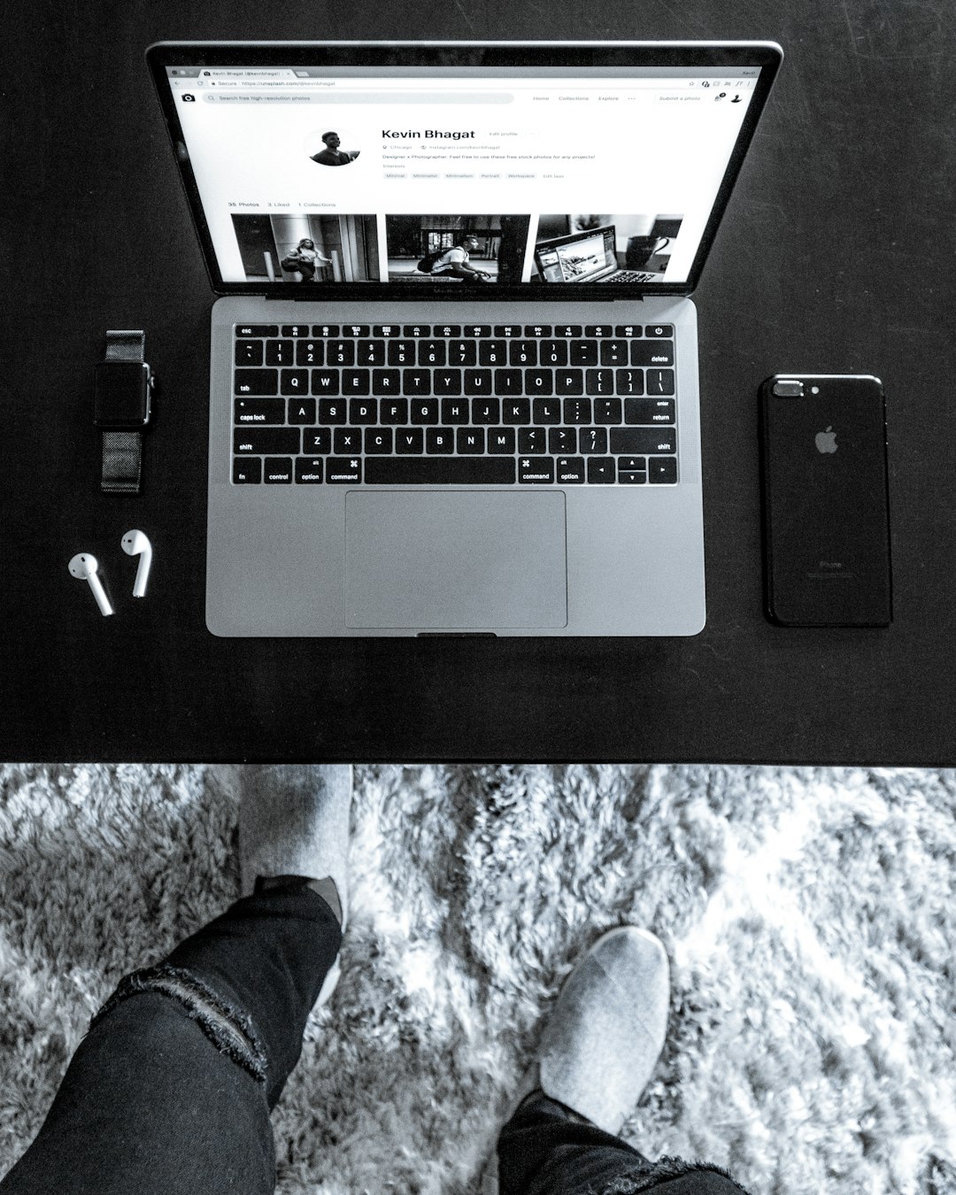 macbook pro beside iphone 5s on black table