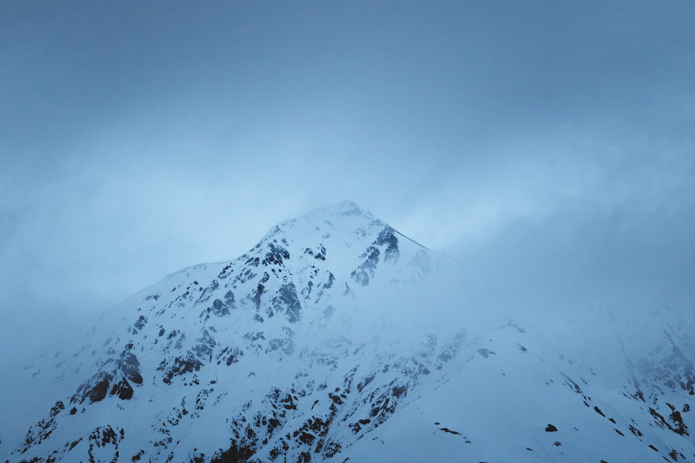 snow-coated hill during daytime