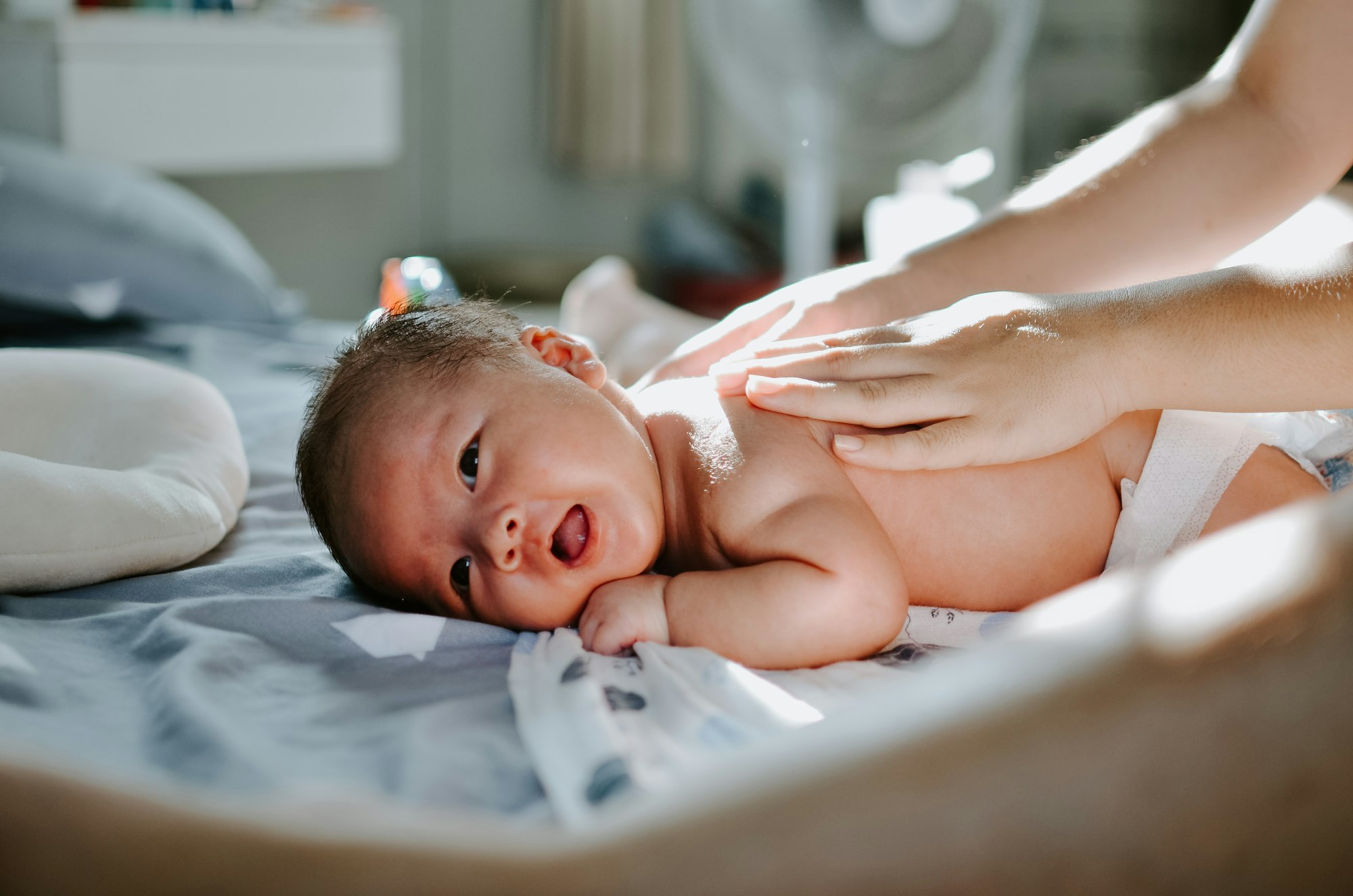 baby massage, massaging a baby, newborn massage