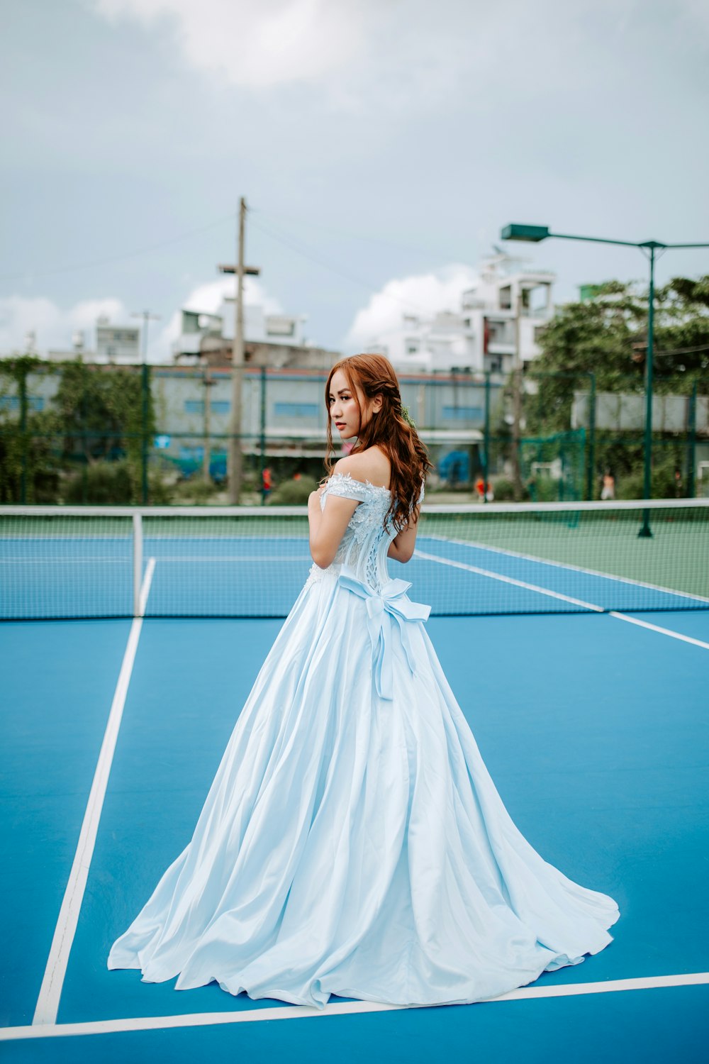 woman standing on tennis court