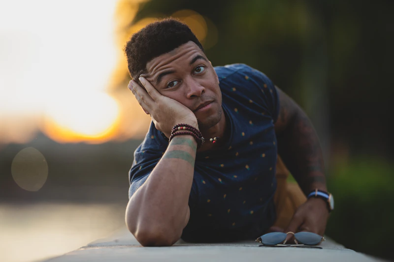 Thoughtful sugar baby lying on a gray surface