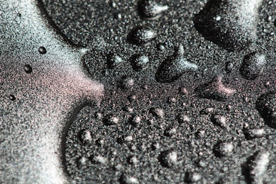 Blue slime mixed with iridescent flakes shimmering in sunlight.