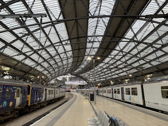 A panoramic view of a modern railway station with sleek design.
