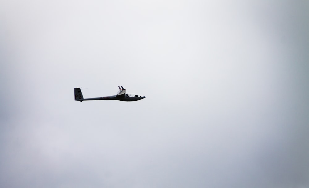 gray plane under gray sky