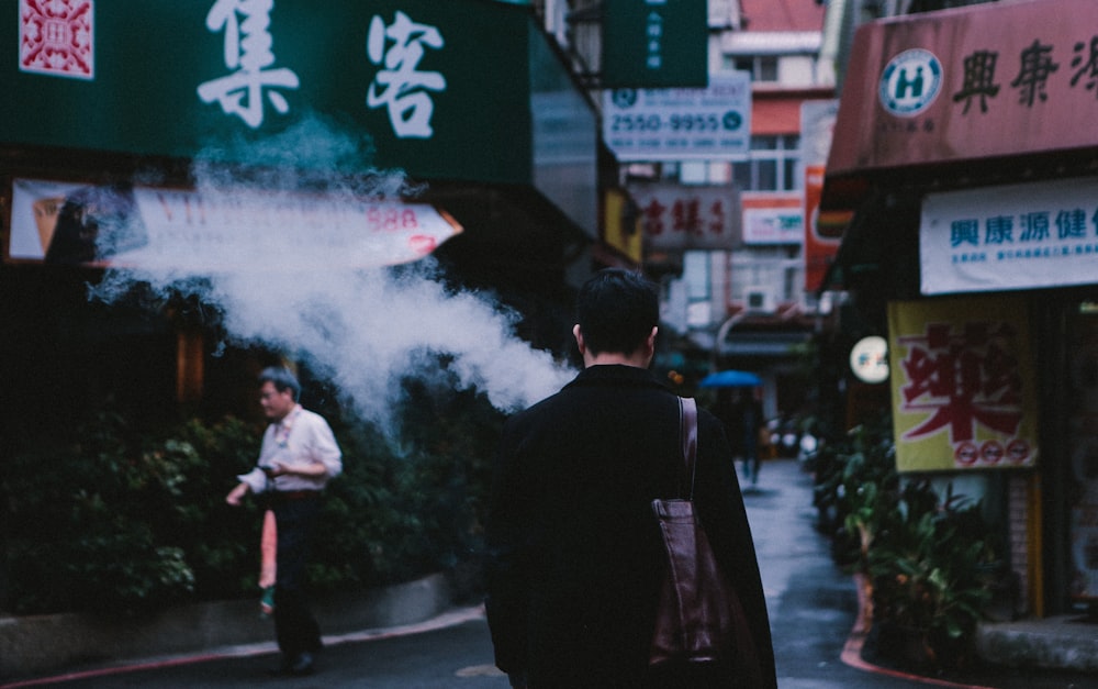 man walking on street photo