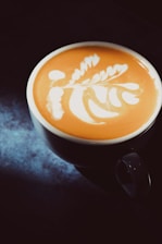 A warm cup of coffee with latte art, glowing softly in morning light.