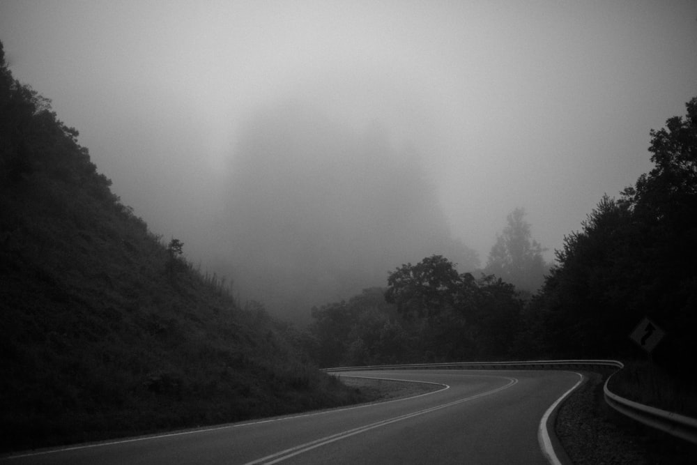 foggy sky under asphalt road