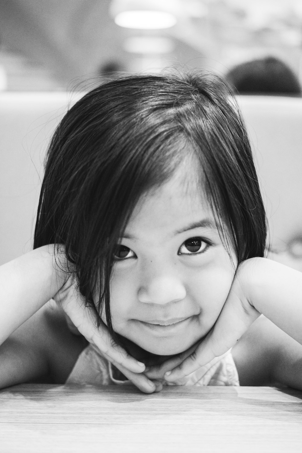 a black and white photo of a little girl