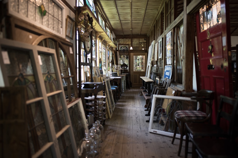 photo of assorted wooden frames inside brown wooden house