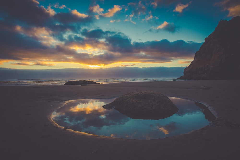 rock near body of water