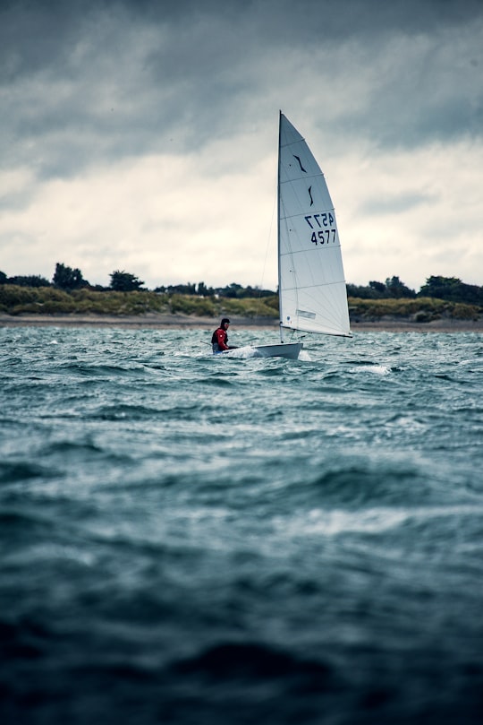 man riding sailboat during day in Hayling Island United Kingdom