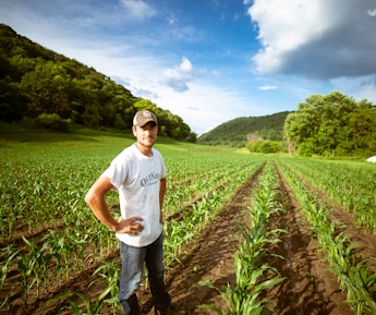 man standing on garden during daytime