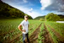 man standing on garden during daytime