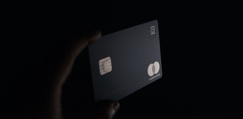 person holding black card