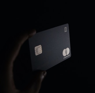 person holding black card