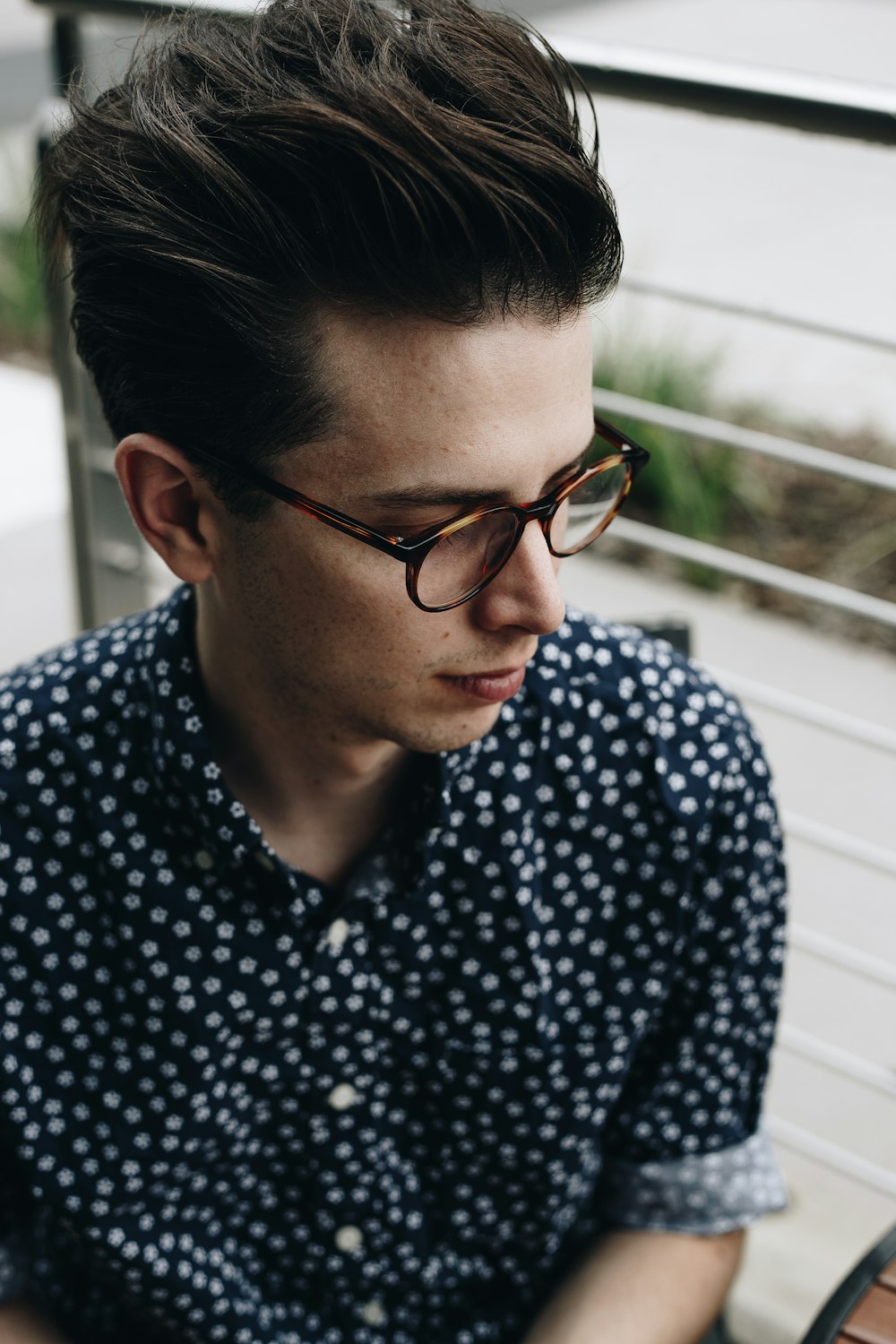 man wearing black and white polka-dot sport shirt