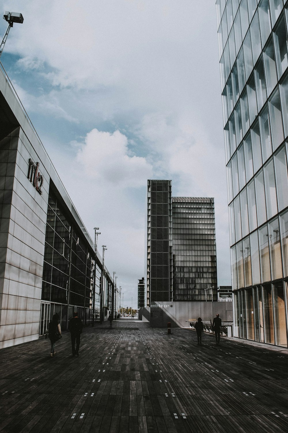 people walking on road near building