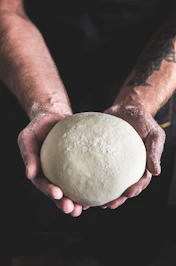 person holding dough