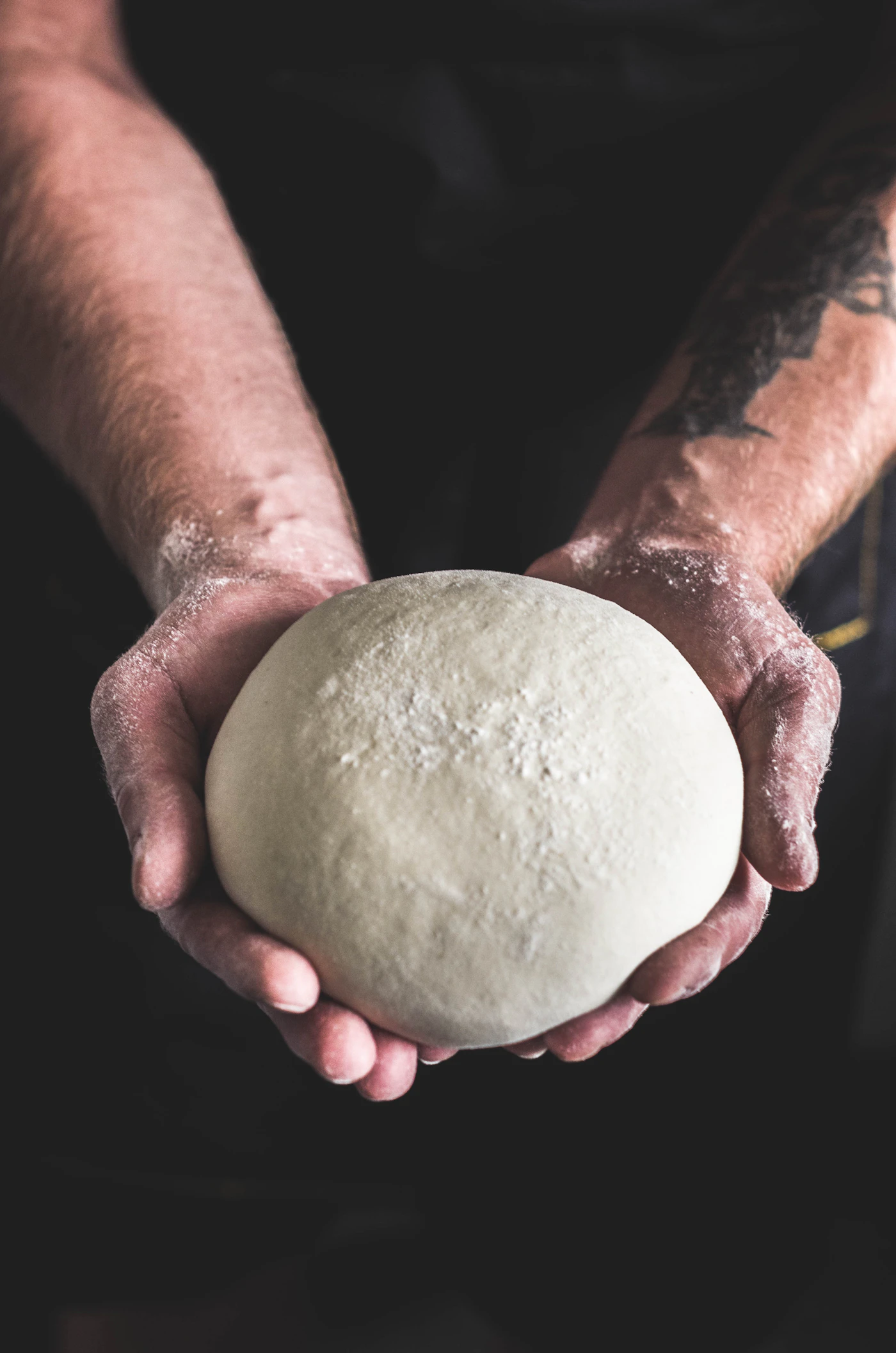 Baker hands preparing dough