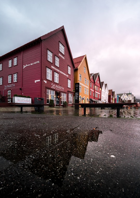 establishments under cloudy sky in Bryggen Norway