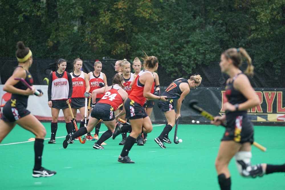 women playing field hockey