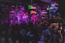 A lively scene of a Cuban band playing live music inside El Cubanito with guests enjoying.