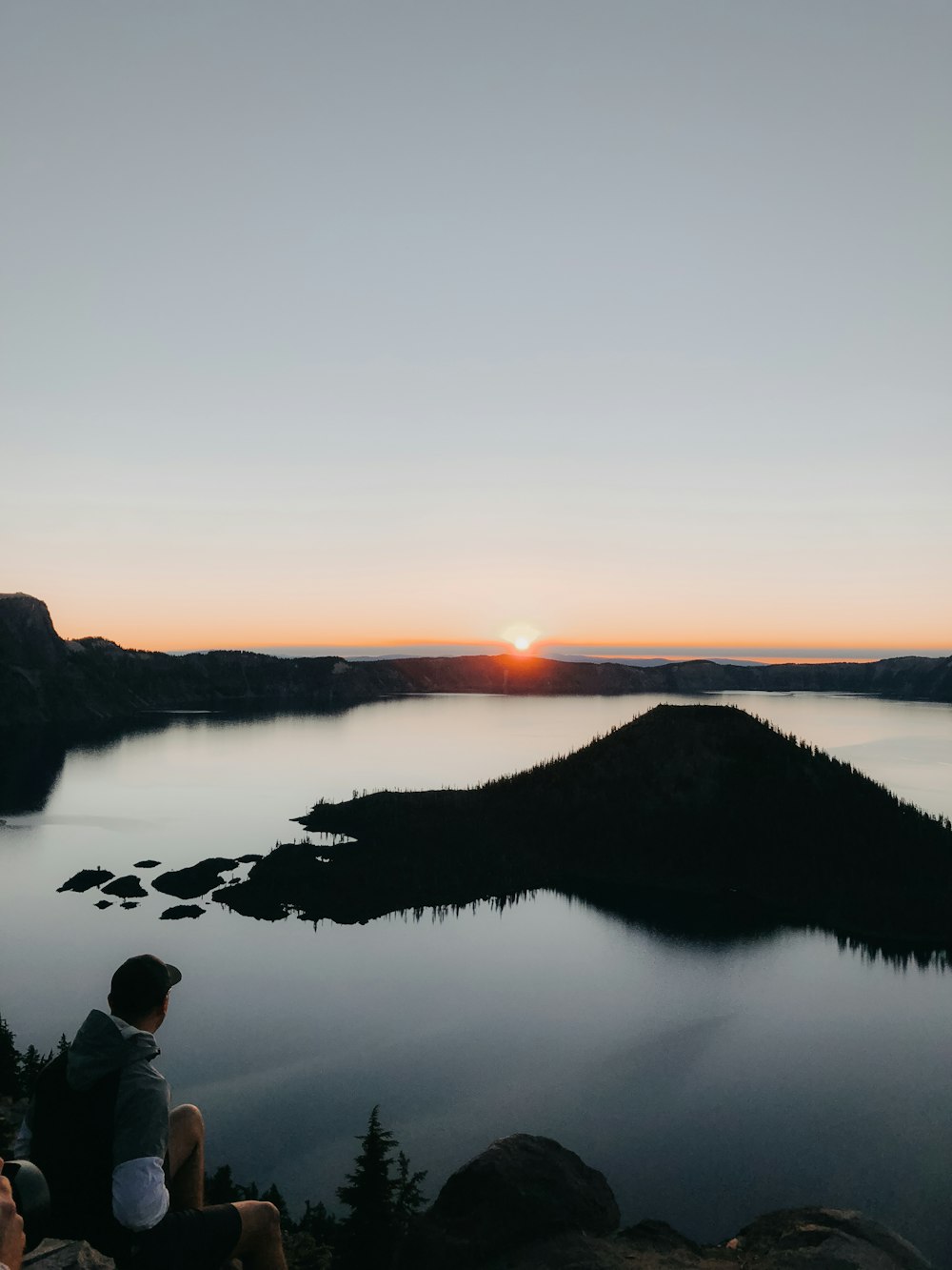 man standing near body of water