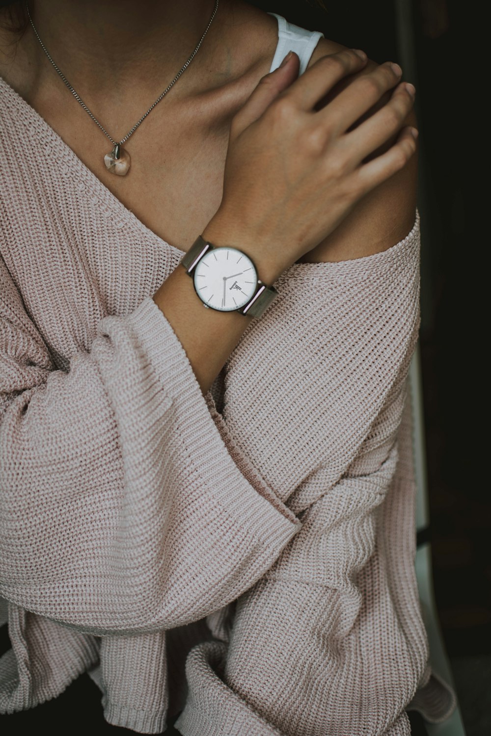 person wearing brown off-shoulder long-sleeved shirt