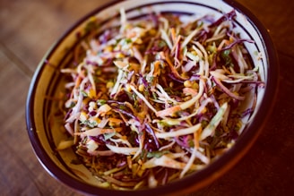 vegetable salad on white and black ceramic bowl