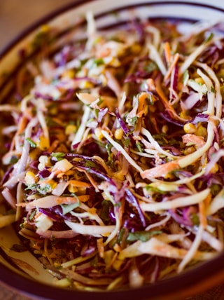 vegetable salad on white and black ceramic bowl