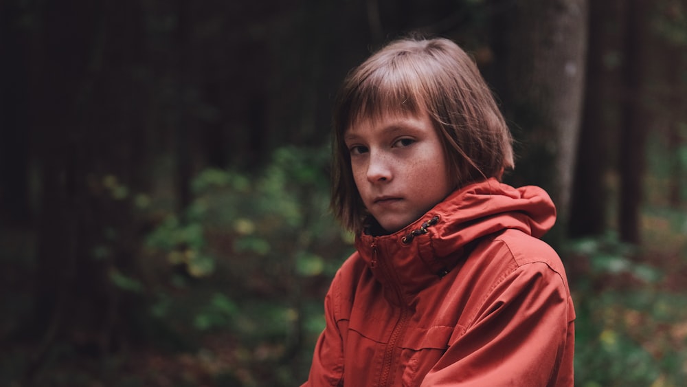 girl wearing red hooded jacket