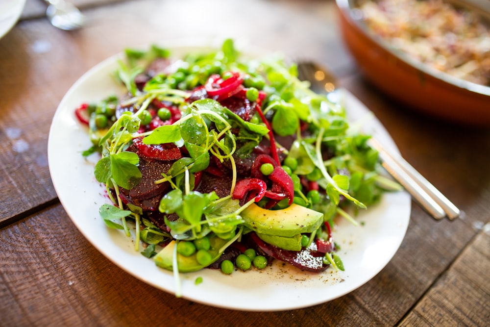 salad on oval white ceramic plate