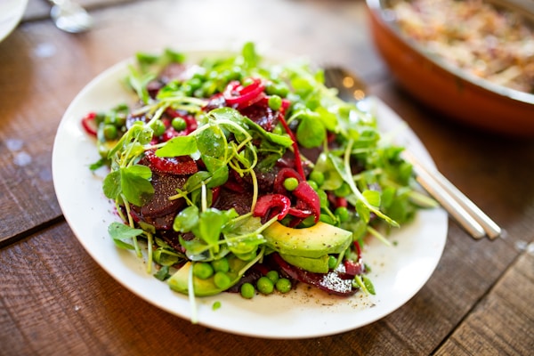 Salad on oval white ceramic plate