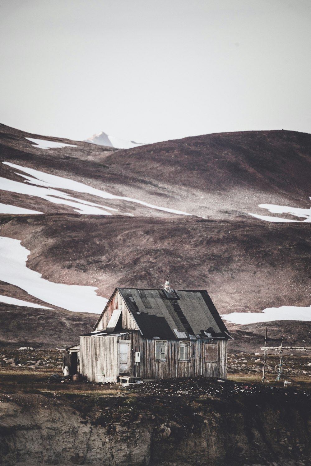 brown house near mountain during daytime