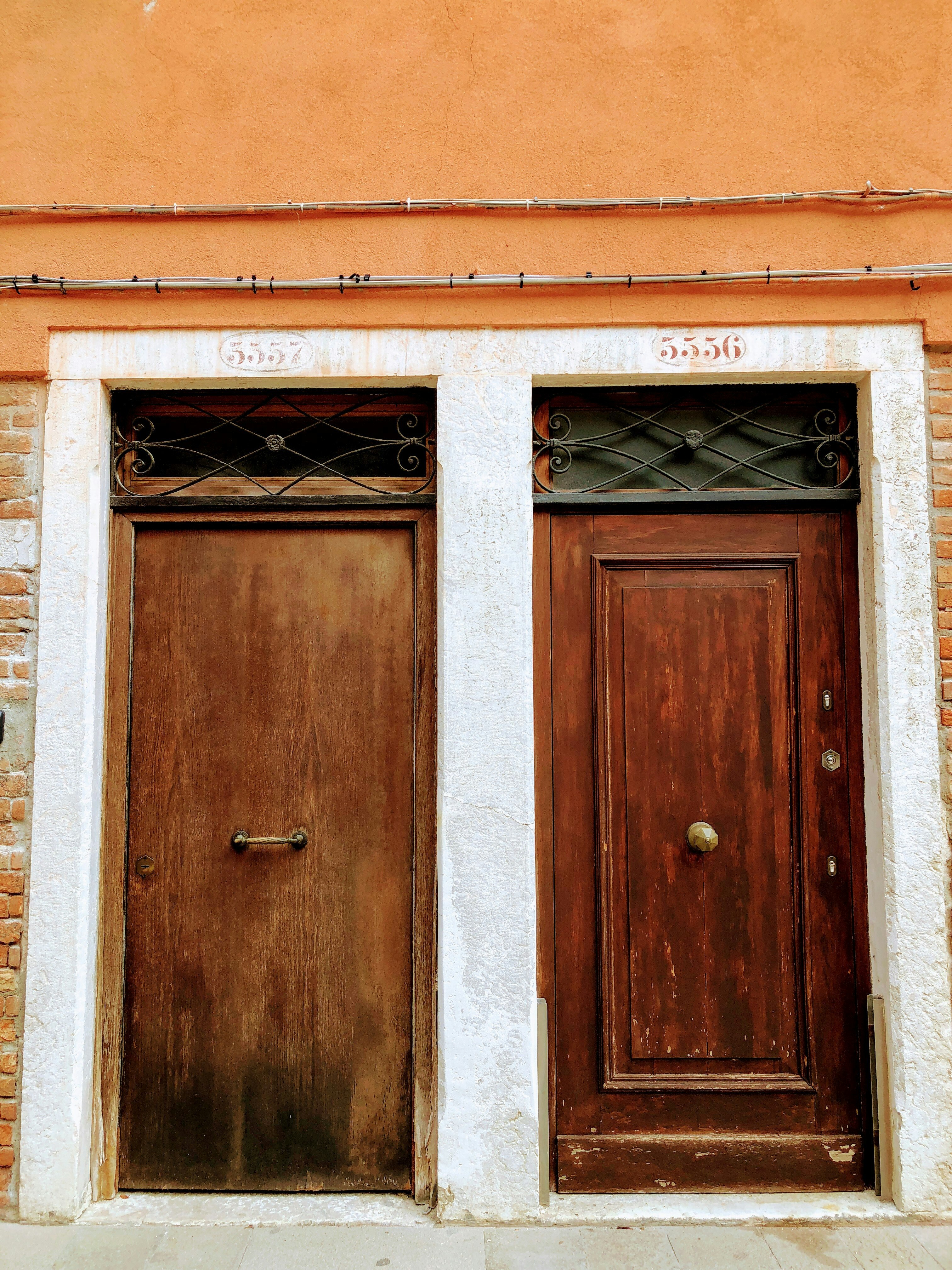 two closed brown wooden doors